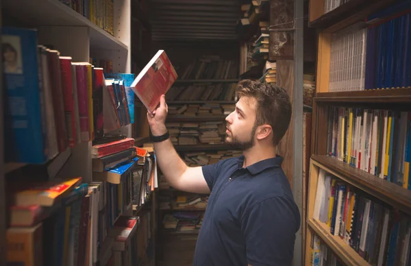 Portrait Man Beard Who Takes Books Shelf Library Student Chooses — Stock Photo, Image