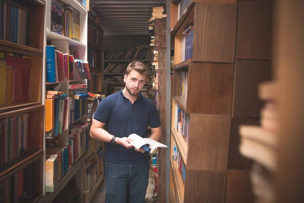 Man Book His Hands Stands Atmospheric Public Library Looks Camera — Stock Photo, Image