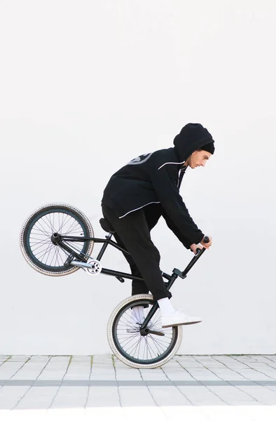 Bmx Racer Makes Trick Background White Wall Bmx Rider Bicycle — Stock Photo, Image