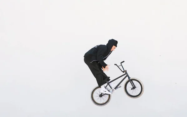 Young Bmx Rider Makes Barzpin Trick Background White Wall Bmx — Stock Photo, Image