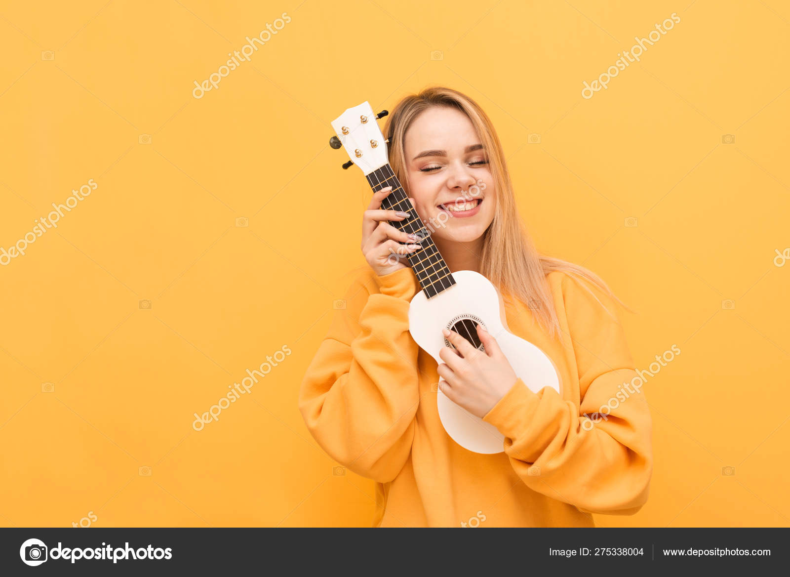 https://st4.depositphotos.com/11328482/27533/i/1600/depositphotos_275338004-stock-photo-cute-girl-hugs-ukulele-with.jpg