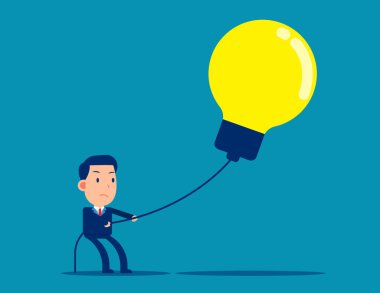 İş adamı büyük ampulü çekiyor. İş fikri ve yaratıcılık