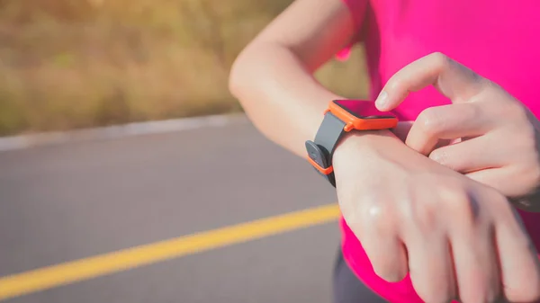 Women exercise in the morning with SmartWatch.