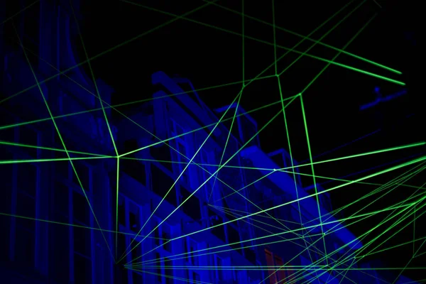 Abstract background with blue and green laser light