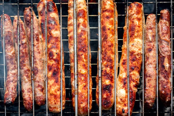 Juicy meat semi-finished sausage and sardels barbecue