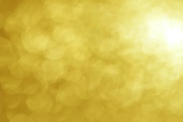 Bright round golden color light bokeh, vivid champagne color background