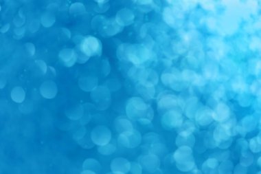 Mavi noel şenlikli soyut arka planda Bokeh ışıkları
