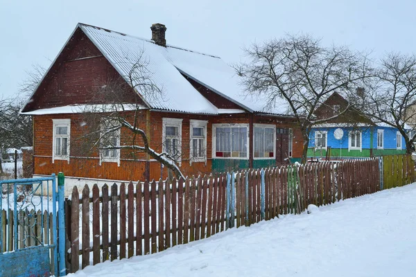 Russian village, Belarus. Winter snow village panorama. Natural wooden texture.