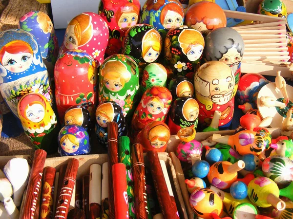Colorful russian wooden nesting dolls are displayed at a market