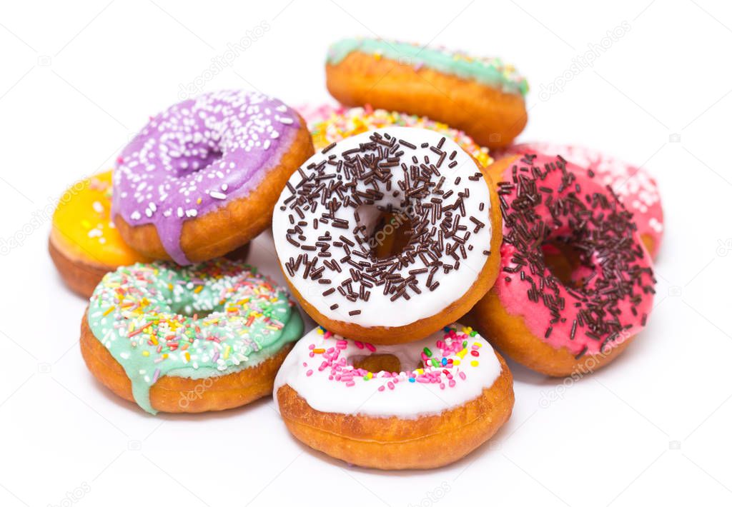 close up view of sweet doughnuts on white background