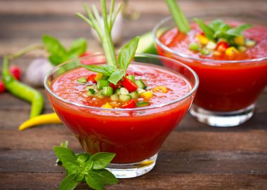 close up view of tasty gazpacho on wooden table clipart