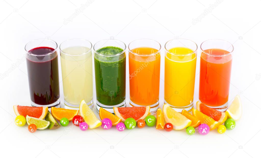 various fresh healthy fruits juices in glasses arranged on white background 