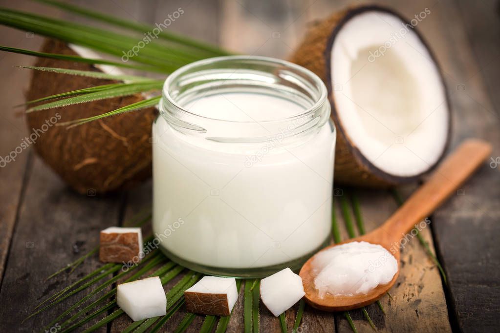 close up view of coconut milk on wooden surface