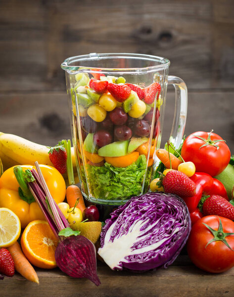 close up view of fresh vegetables and fruits on wooden background