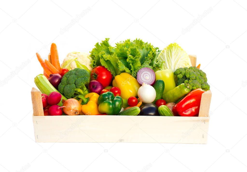 close up view of fresh vegetables in wooden box