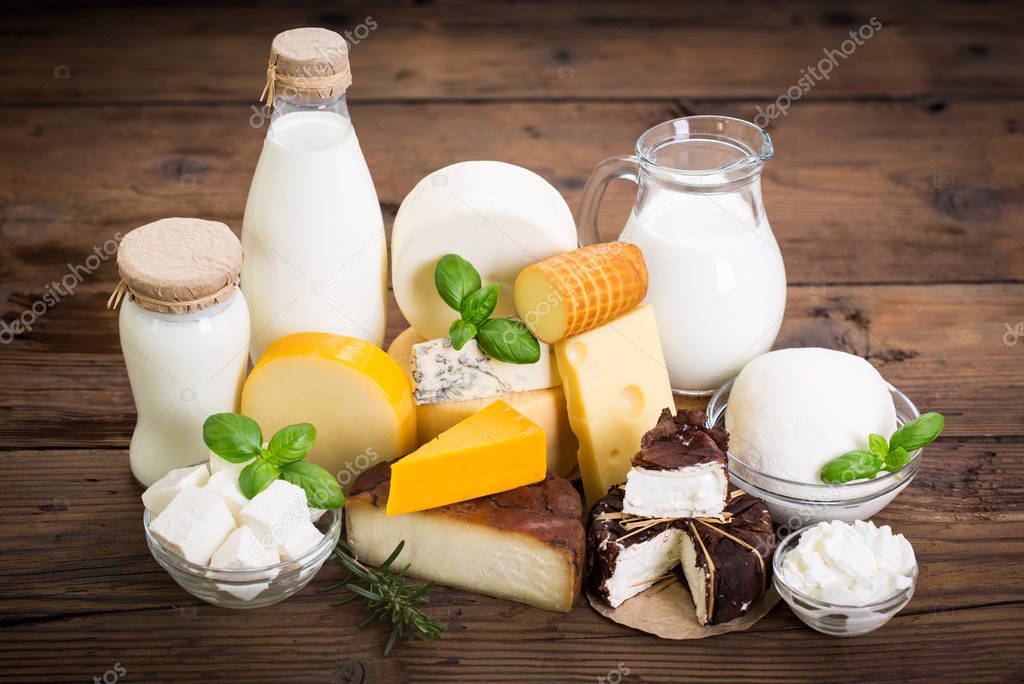 tasty cheese assortment on wooden tabletop