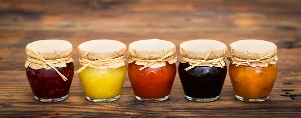 Various homemade fruit jam in the jars