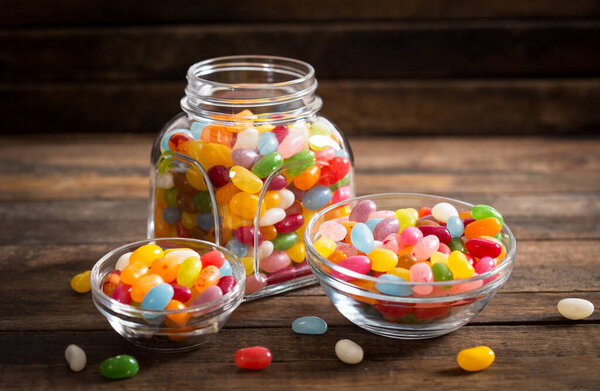 Jelly beans in the glass bowl and jar