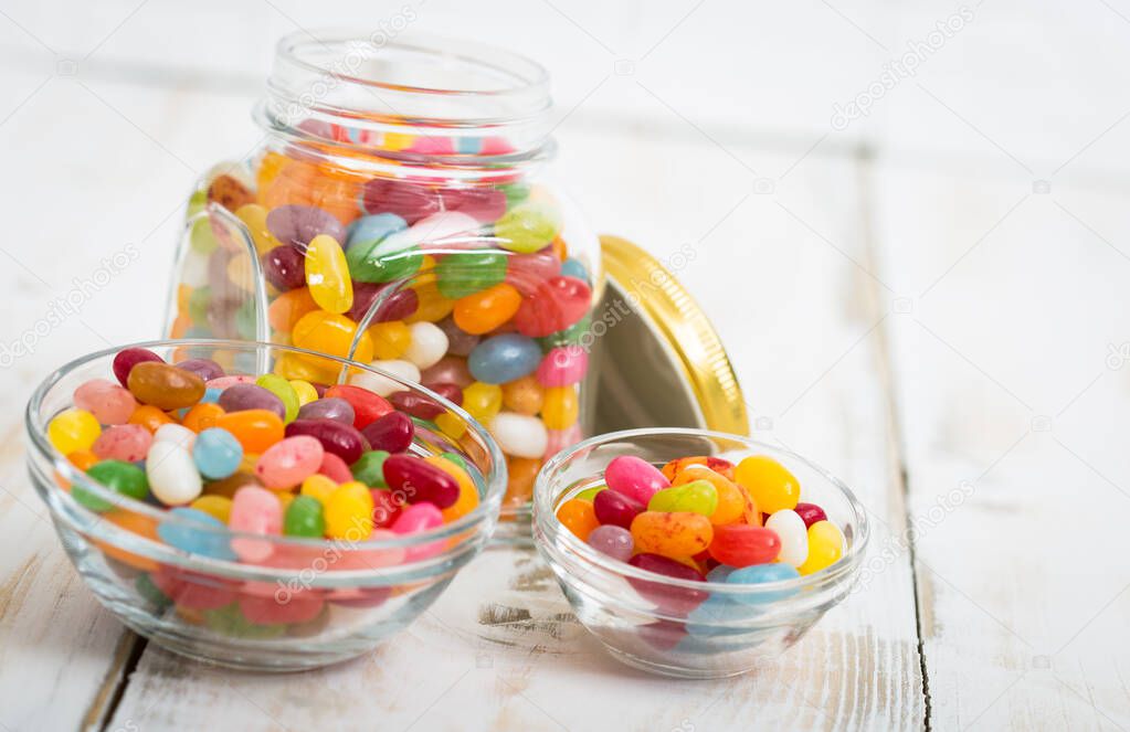 Jelly beans in the glass bowl and jar