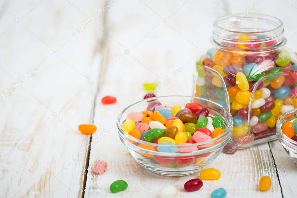 Jelly beans in the glass bowl and jar