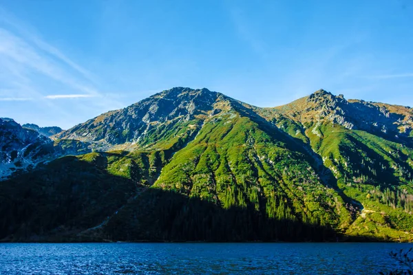 Picturesque  mountain lake Sea Eye. Morskie Oko is the largest mountain lake in the Rybi Potok Valley, the Tatras, near Zakopane, lying on the Polish side of the mountains, under the peak of Rysy (1395,4 m). October 6, 2018.