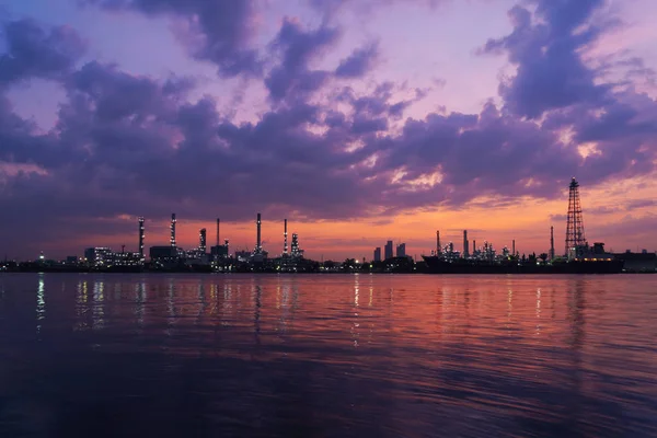 Bangchak Petroleum's oil refinery at sunrise in industrial engineering concept. Water reflection. Oil and gas industry. Urban city, Bangkok, Thailand