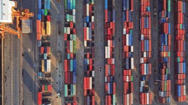 Aerial top view of container cargo ship in the export and import business and logistics international goods in urban city. Shipping cargo to the harbor by crane. clipart