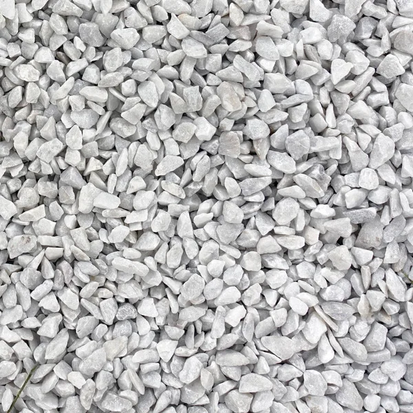 White granite gravel stones flooring pattern surface texture. Close-up of exterior material for design decoration background