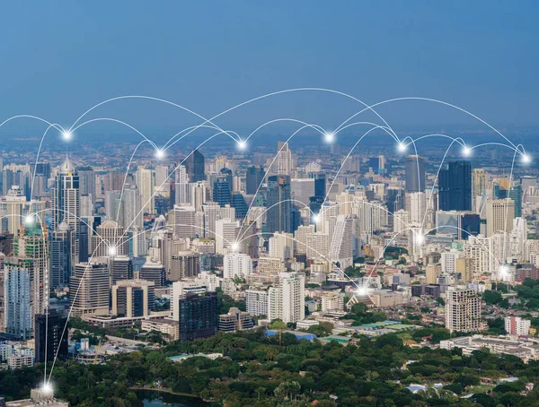 Digital network connection lines of Sathorn, Bangkok Downtown, Thailand. Financial district and business centers in smart urban city in Asia. Skyscraper and high-rise buildings at noon.