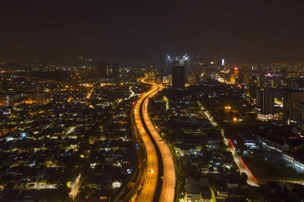 Aerial view of highway junctions at night. Bridges, roads, or st