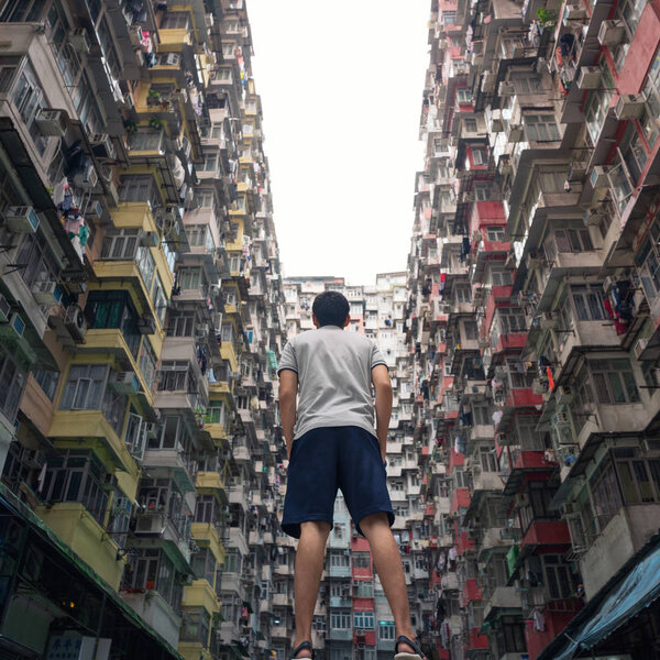 A tourist man with Yick Fat Building in travel Hong Kong concept