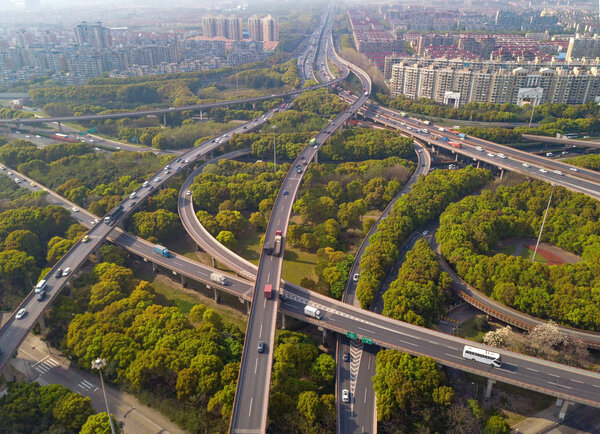 Aerial view of cars on highway junctions. Bridge roads or street