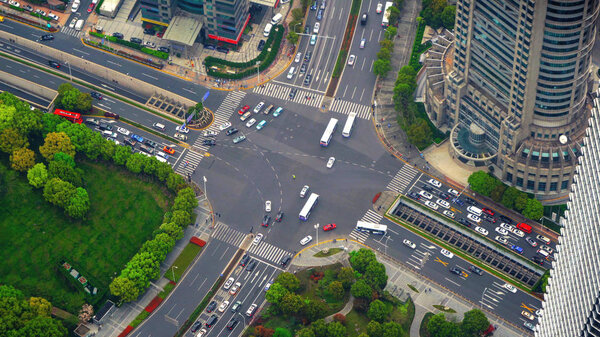 Aerial view of highway junctions shape letter x cross. Bridges, roads, or streets in transportation concept. Structure shapes of architecture in urban city, Shanghai Downtown, China