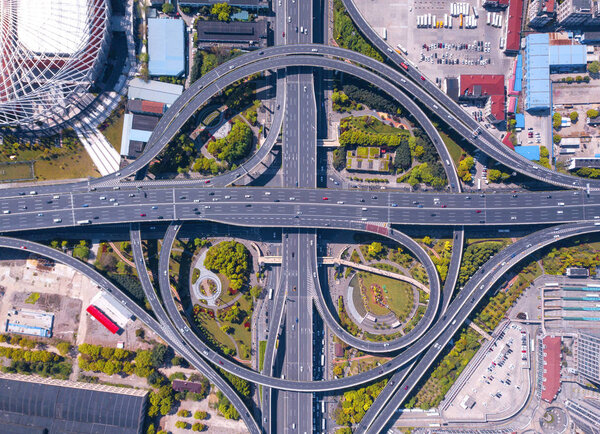 Aerial view of highway junctions with roundabout. Bridge roads s
