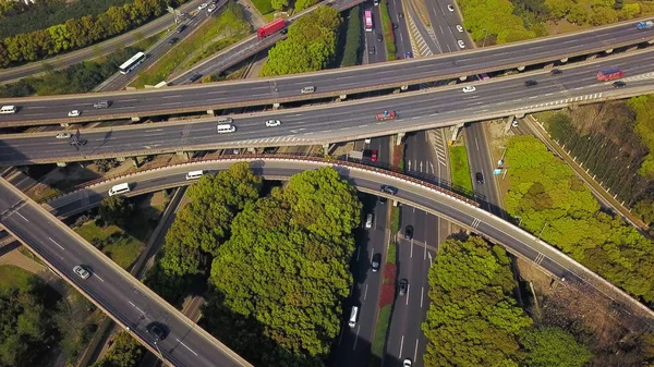 Aerial view of cars on highway junctions. Bridge roads or street