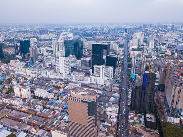 Aerial view of Rama 9 road, New CBD, Bangkok Downtown, Thailand. Financial district and business centers in smart urban city in Asia. Skyscraper and high-rise buildings.