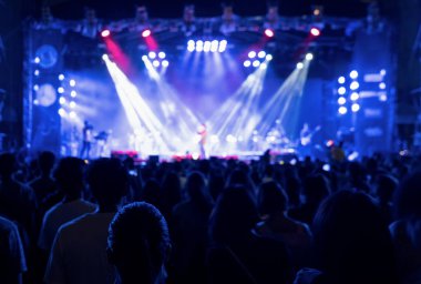 Silhouettes of crowd, group of people, cheering in live music co clipart