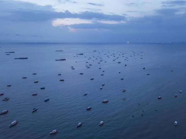 Aerial view of boats in Pattaya sea, beach with sunset sky for t