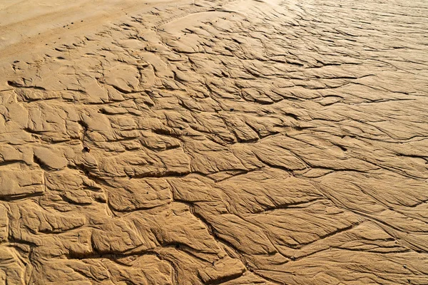 Close-up van bruin Golf zand of Rock patroon textuur achtergrond o — Stockfoto