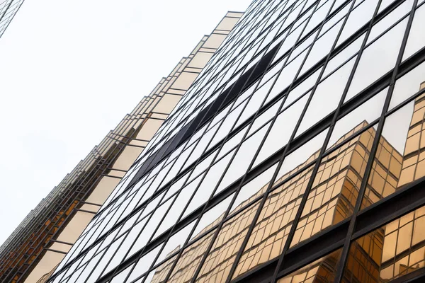 Golden building. Windows glass of modern office skyscrapers in t — Stock Photo, Image