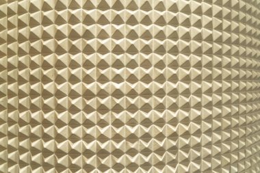 Üçgen piramit fayans desenli yüzey dokusu. Kemerin yakın çekimi