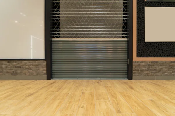 Retail shop or store closing. Steel metal roller shutter door in — Stock Photo, Image