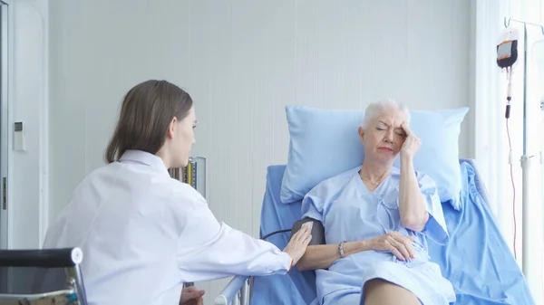 Woman Doctor Talking Sad News Checking Blood Pressure Test Depressed — Stock Photo, Image