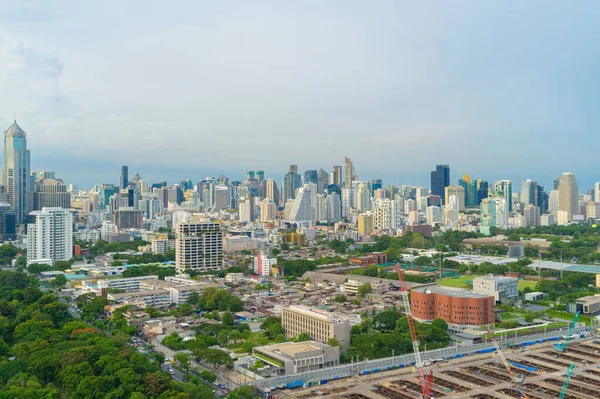 Aerial view of green trees in Lumpini Park, Sathorn district, Bangkok Downtown Skyline. Thailand. Financial district and business center in smart urban city in Asia. Skyscraper buildings