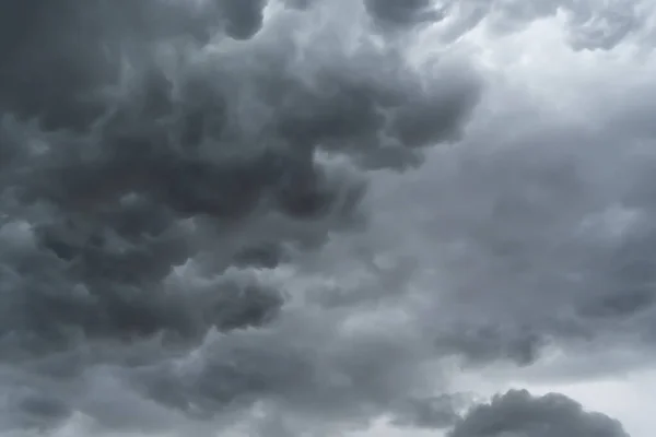 Dramatic dark grey clouds sky with thunder storm and rain. Abstract nature landscape background.