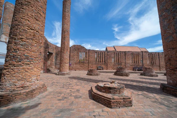 Old ruins of a temple in Phra Nakhon Si Ayutthaya province near Bangkok, Thailand. An old buddha statue in ancient temple. Famous tourist attraction landmark. History of Thai architecture.