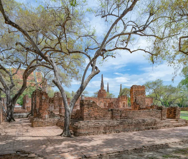 Old ruins of a temple in Phra Nakhon Si Ayutthaya province near Bangkok, Thailand. An old buddha statue in ancient temple. Famous tourist attraction landmark. History of Thai architecture.