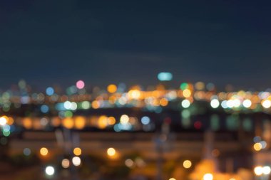 Bangkok, Tayland 'daki gökdelen binalarının soyut arkaplanı Bokeh, gece vakti bulanık fotoğraf. Şehir manzarası.