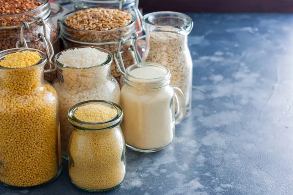 Various Cereals Glass Jars Rice Millet Oatmeal Couscous Buckwheat Semolina — Stock Photo, Image