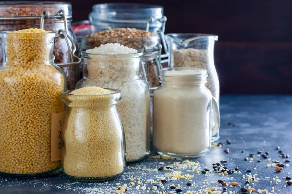 Various Cereals Glass Jars Rice Millet Oatmeal Couscous Buckwheat Semolina — Stock Photo, Image